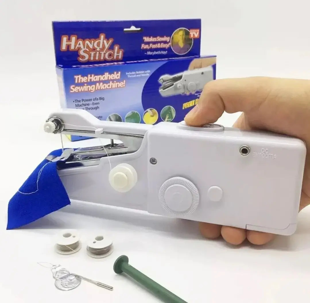 Handheld sewing machine with accessories on a white background, including the Handy Stitch packaging.